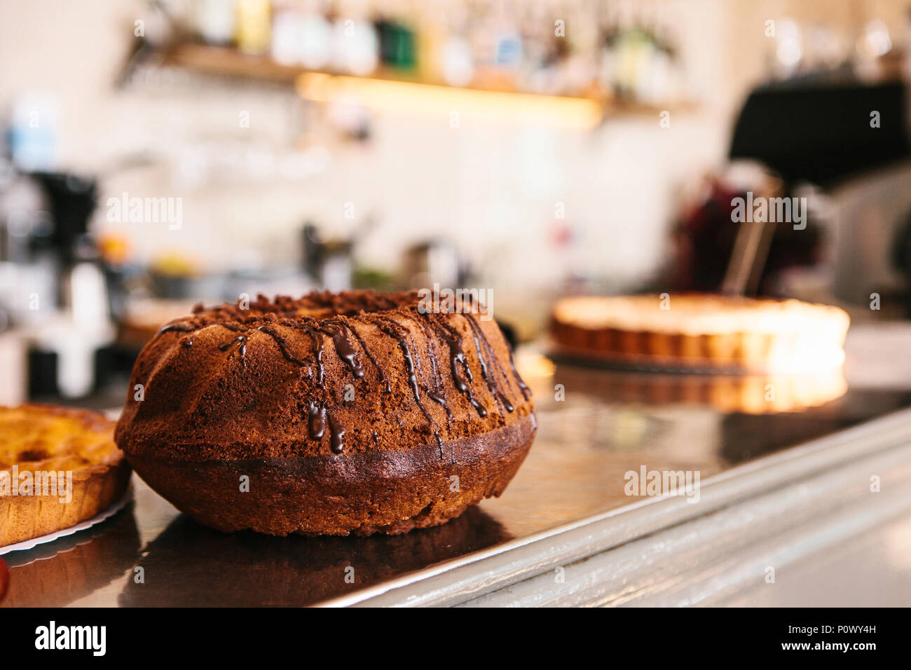 A fresh cupcake on the counter of a bar or in a cafe or in a small home-made food shop Stock Photo