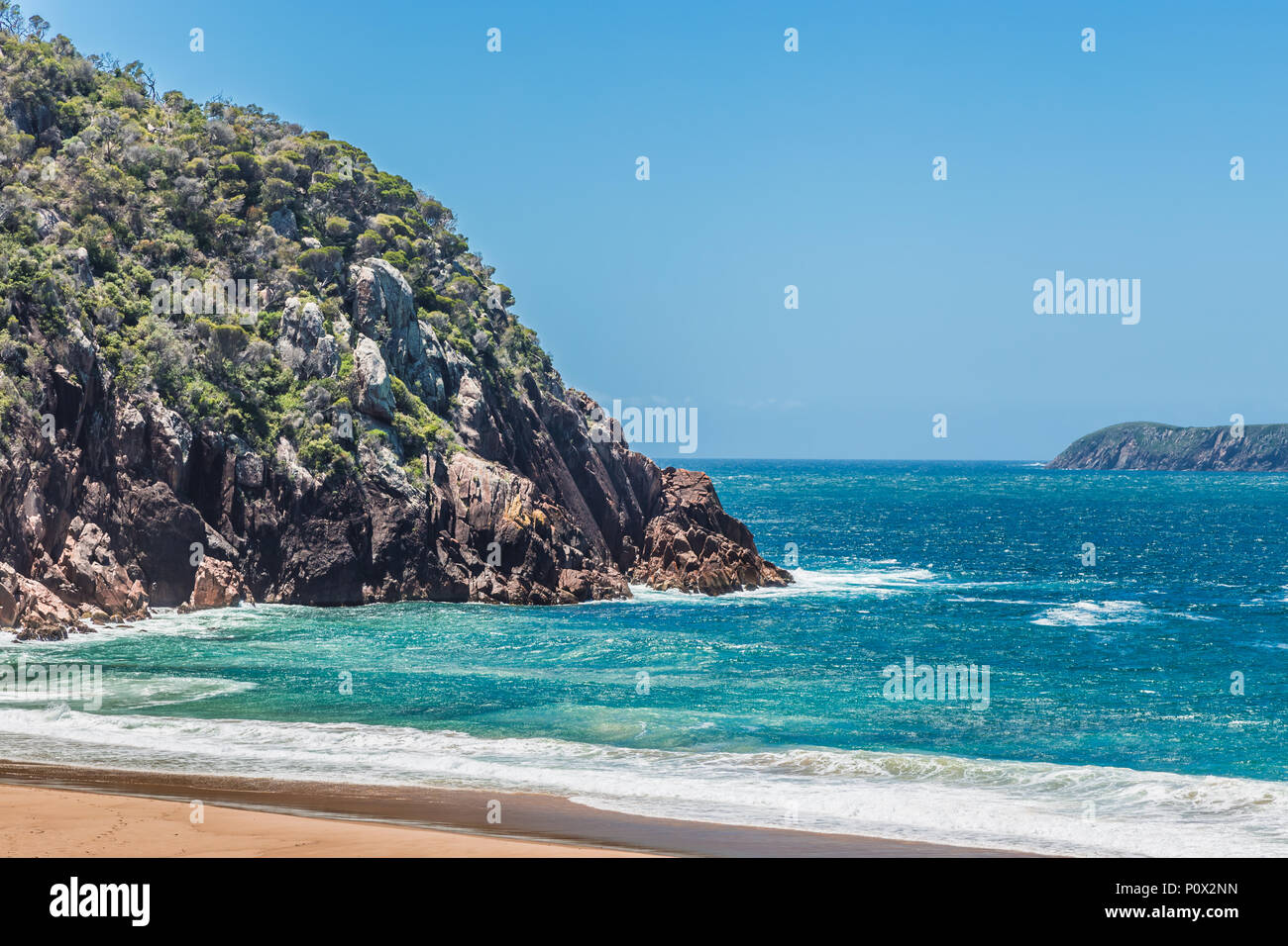 View of Zenith Beach, Port Stephens, NSW, Australia, showing the rocky outcrop, and the outlet to the open sea. Stock Photo