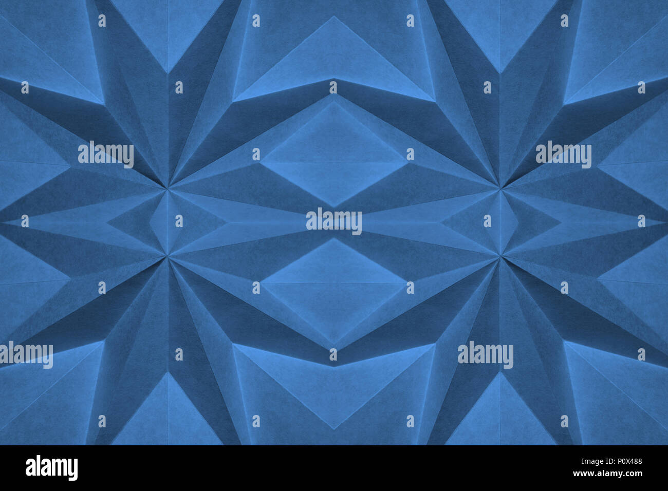 blue origami based background abstract wallpaper. Shallow focus, graphic macro, angular, monochrome folded paper. Pantone 16-4132; Little Boy Blue Stock Photo