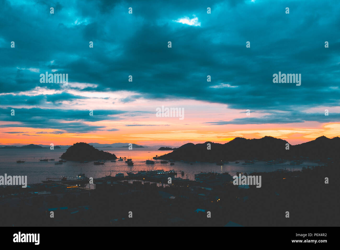 View of the Labuan Bajo port at dusk, island of Flores (East Nusa Tenggara), Indonesia. Stock Photo