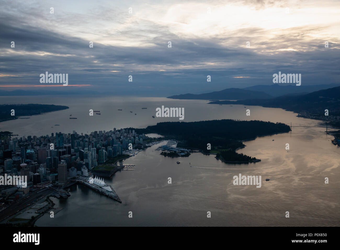 Aerial view of Downtown City during a vibrant cloudy sunset. Taken in ...