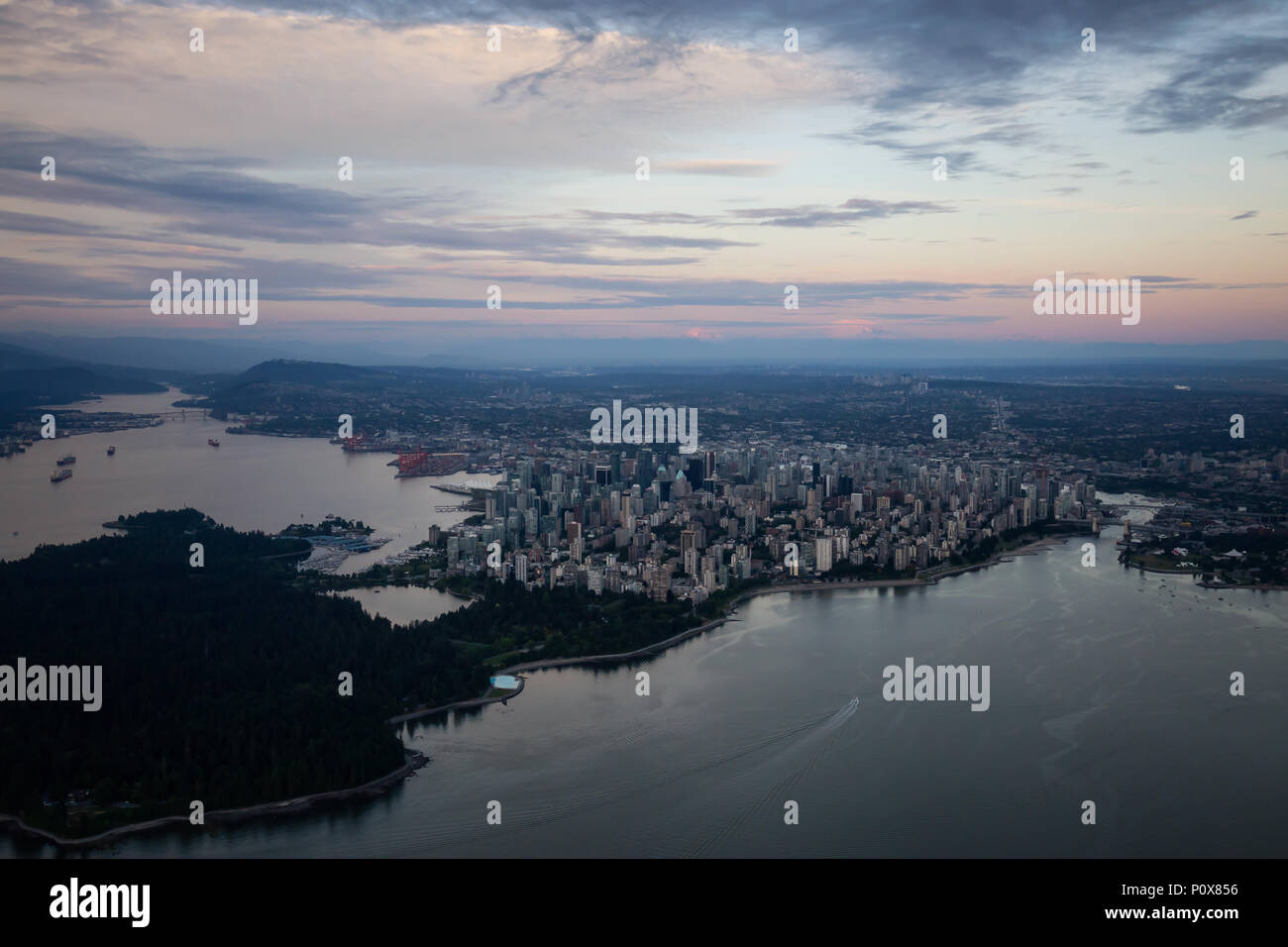 Aerial view of Downtown City during a vibrant cloudy sunset. Taken in ...