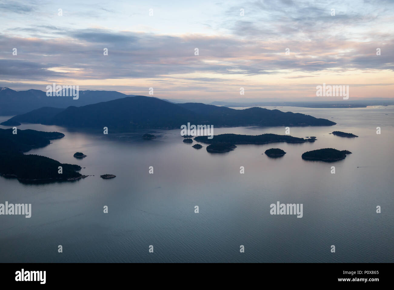 Aerial view of the Islands in Howe Sound during a vibrant sunset. Taken ...