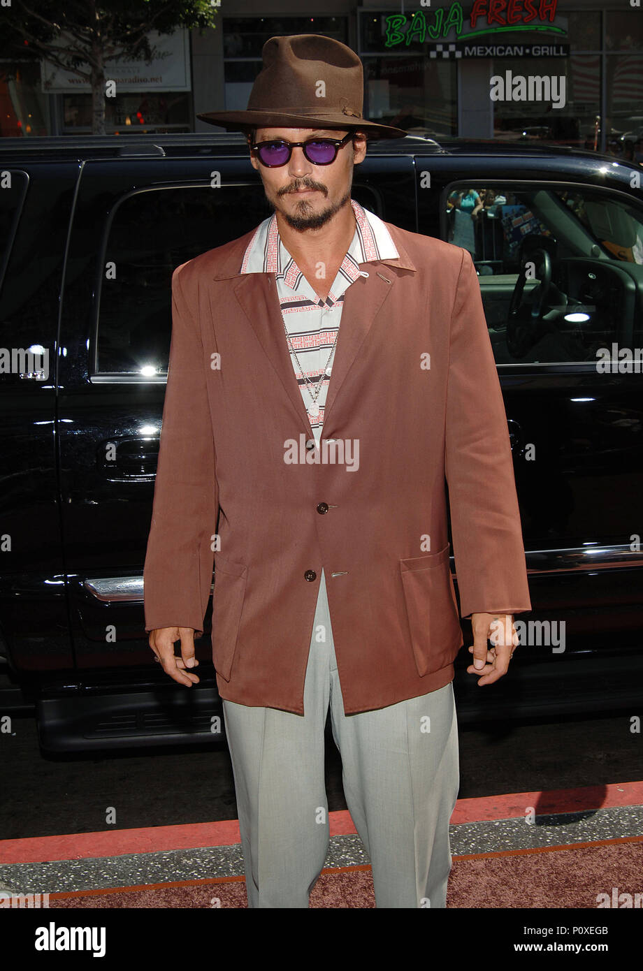 Johnny Depp arriving at the Charlie And The Chocolat Factory Premiere at the Chinese Theatre In Los Angeles. Jyly 10, 2005. 02 DeppJohnny018 Red Carpet Event, Vertical, USA, Film Industry, Celebrities,  Photography, Bestof, Arts Culture and Entertainment, Topix Celebrities fashion /  Vertical, Best of, Event in Hollywood Life - California,  Red Carpet and backstage, USA, Film Industry, Celebrities,  movie celebrities, TV celebrities, Music celebrities, Photography, Bestof, Arts Culture and Entertainment,  Topix, vertical, one person,, from the years , 2003 to 2005, inquiry tsuni@Gamma-USA.com  Stock Photo