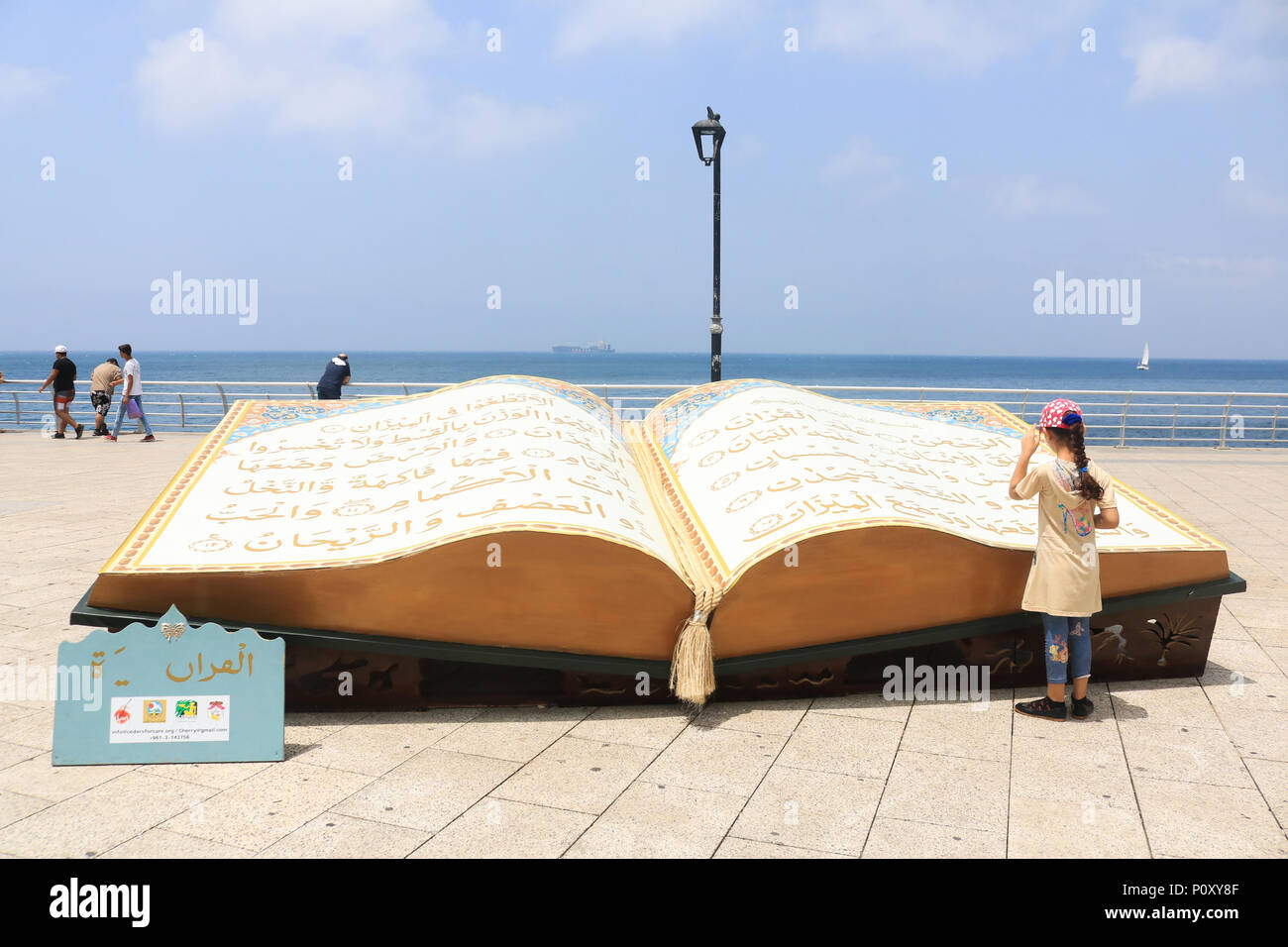 Beirut Lebanon. 1oth June. A large opened Quran book is displayed on the Beirut  seafront promenade  to celebrate the Islamic holy month of Ramadan which ends on 15th June. Ramdan traditionally falls on the ninth month of the Islamic calendar, and is observed by Muslims worldwide as a month of fasting (Sawm) to commemorate the first revelation of the Quran to the prophet Muhammad Credit: amer ghazzal/Alamy Live News Stock Photo