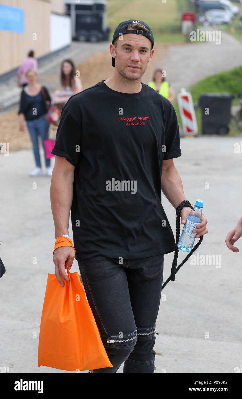 10 June 2018, Balve, Germany: Soccer national team goalkeeper Manuel Neuer arrives with his dog to watch the performance of his wife Nina Neuer, who is competing in the Grand Prix U25 with horse Don Darius. Photo: Friso Gentsch/dpa Stock Photo