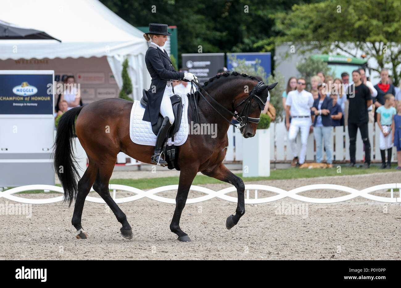 10 June 2018, Balve, Germany: Nina Neuer, equestrian athlete coincidentally married to soccer national team goalkeeper Manuel Neuer competes in the Grand Prix U25 with horse Don Darius. Photo: Friso Gentsch/dpa Stock Photo