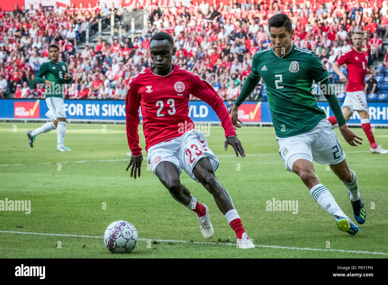 Denmark, Brøndby - June 09, 2018. Pione Sisto (23) of Denmark is followed by Hugo Ayala Castro (2) of Mexico during the football friendly between Denmark and Mexico at Brøndby Stadion. (Photo credit: Gonzales Photo - Kim M. Leland). Credit: Gonzales Photo/Alamy Live News Stock Photo