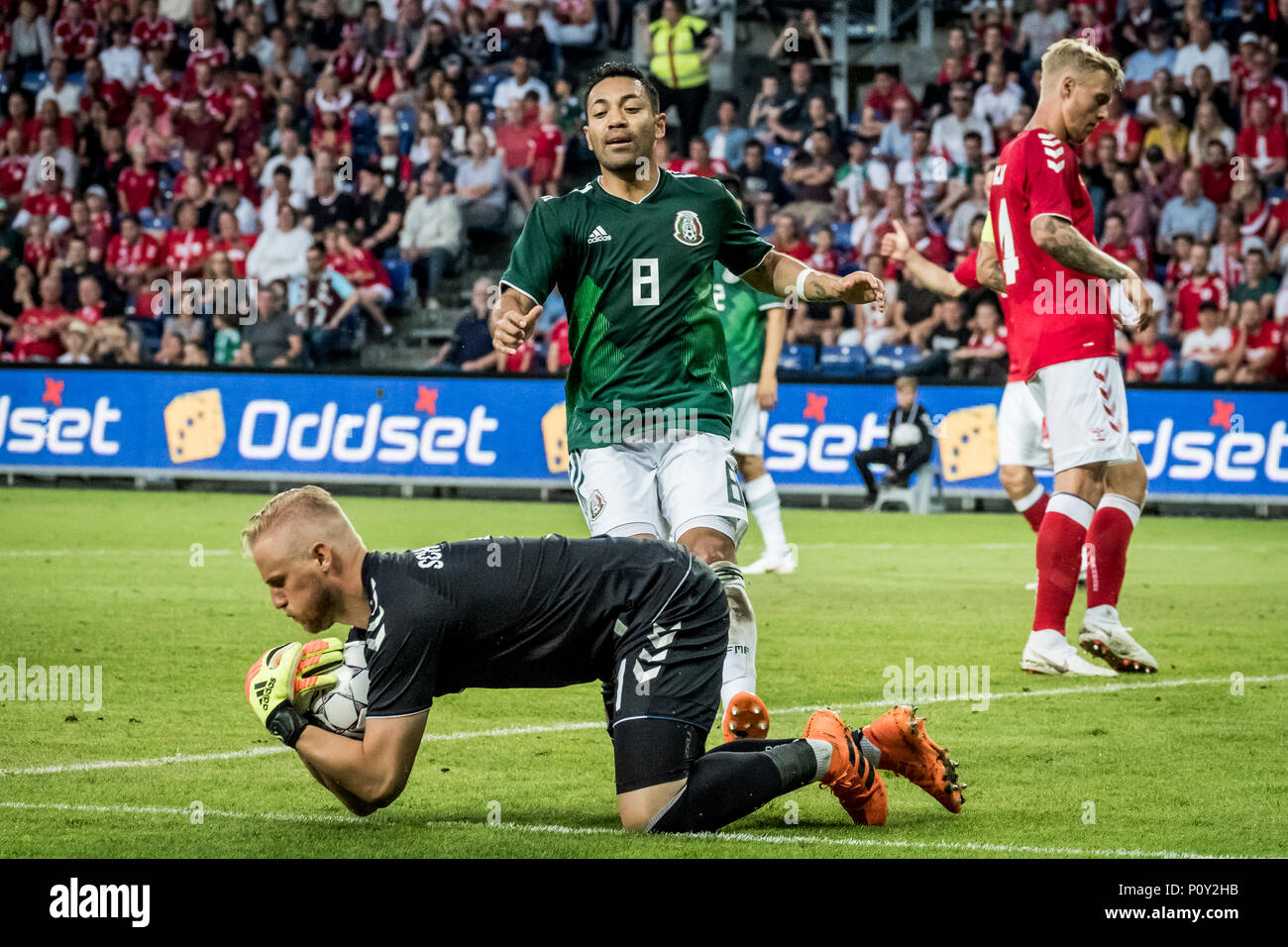 Denmark, Brøndby - June 09, 2018. Goalkeeper Kasper Schmeichel (1) of Denmark is catching the ball infront of Marco Fabian of Mexico (8) during the football friendly between Denmark and Mexico at Brøndby Stadion. (Photo credit: Gonzales Photo - Kim M. Leland). Credit: Gonzales Photo/Alamy Live News Stock Photo