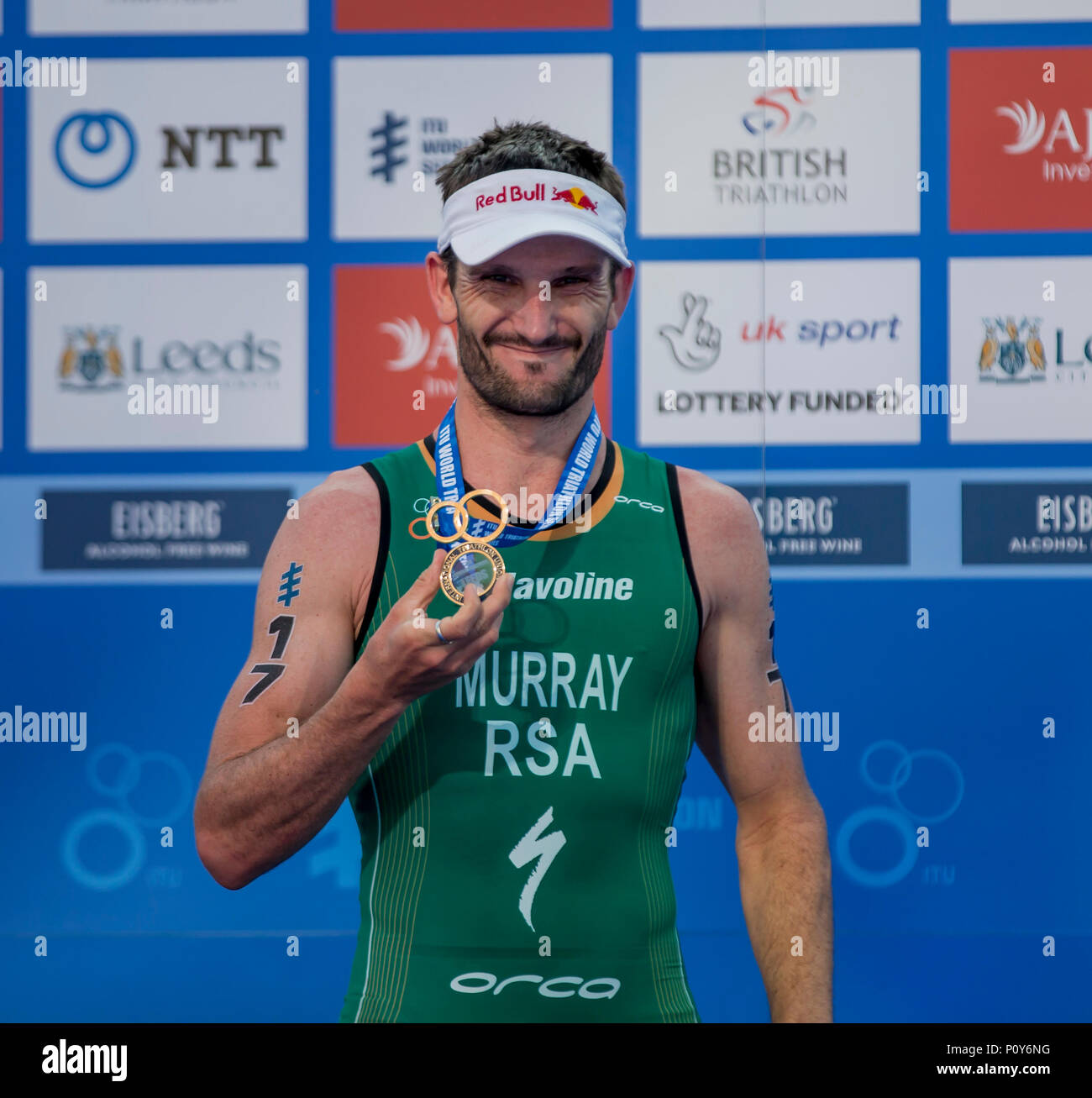Leeds, UK. 10th June, 2018. AJ Bell World Triathlon Series, Leeds; Richard Murray (RSA) shows off his first place medal on the winners podium after winning the Elite Mens race of the AJ Bell World Triathlon Leeds Credit: Action Plus Sports/Alamy Live News Stock Photo