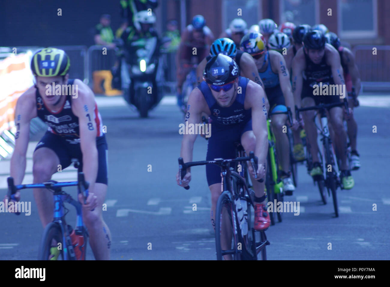 Leeds, Uk. 10th June 2018. Jonny Brownlee, number 18, of GBR and Ben Kanute, number 31 of USA, during the bike section of the ITU World series Triathlon Leeds mens' event. Credit: Jonathan Sedgwick/ Alamy Live News. Stock Photo