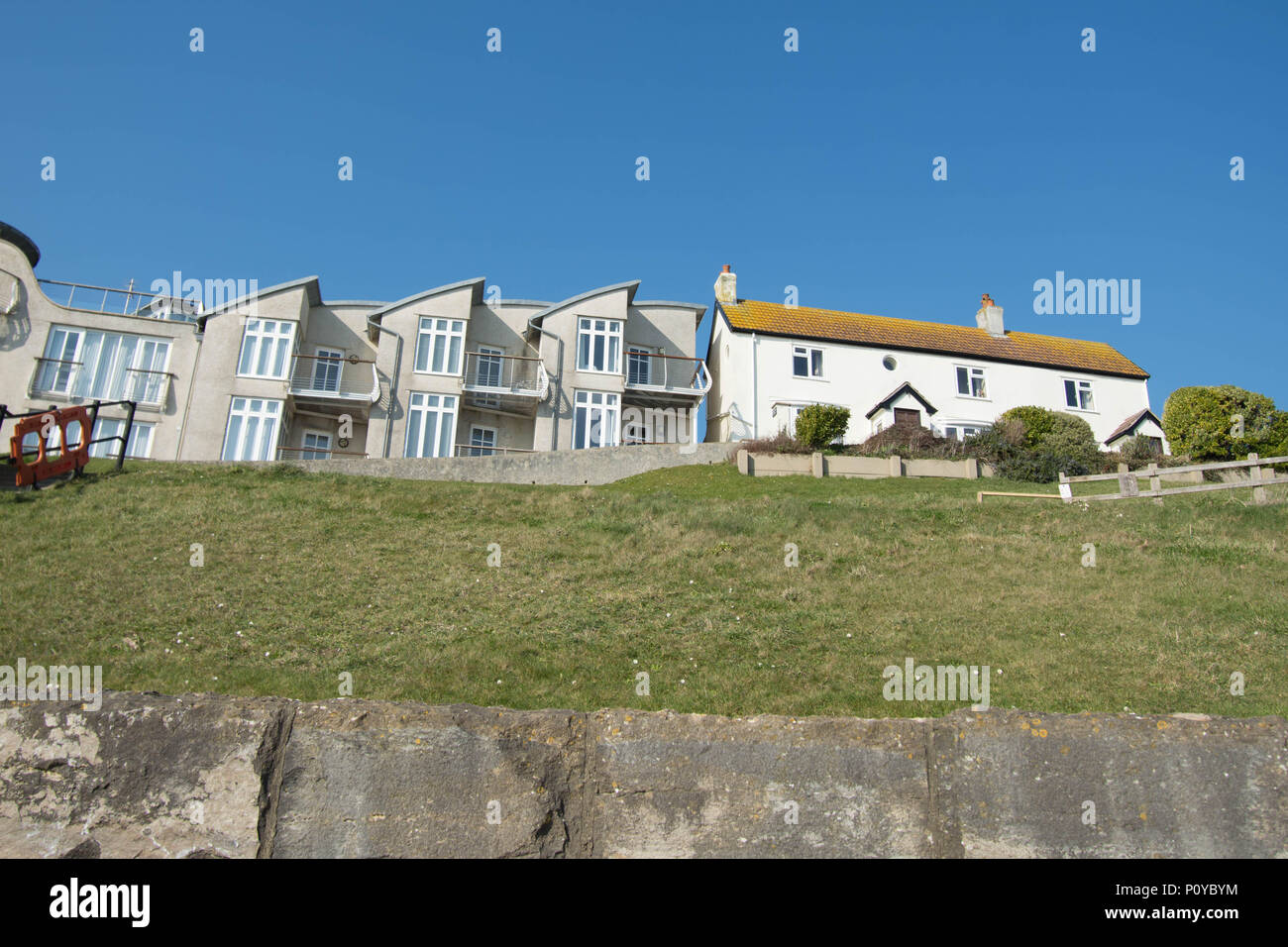 Lime Regis England coast walk grass houses house flat flats wall rail