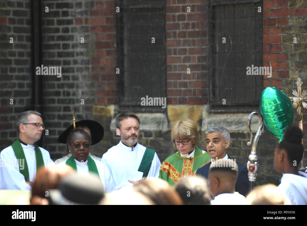 Mayor of London Sadiq Khan (right) and Bishop of London Sarah Mullally (second right) attend the dedication of a new memorial garden at St Clement's Church, Notting Dale, west London to mark the first anniversary of Grenfell disaster. Stock Photo