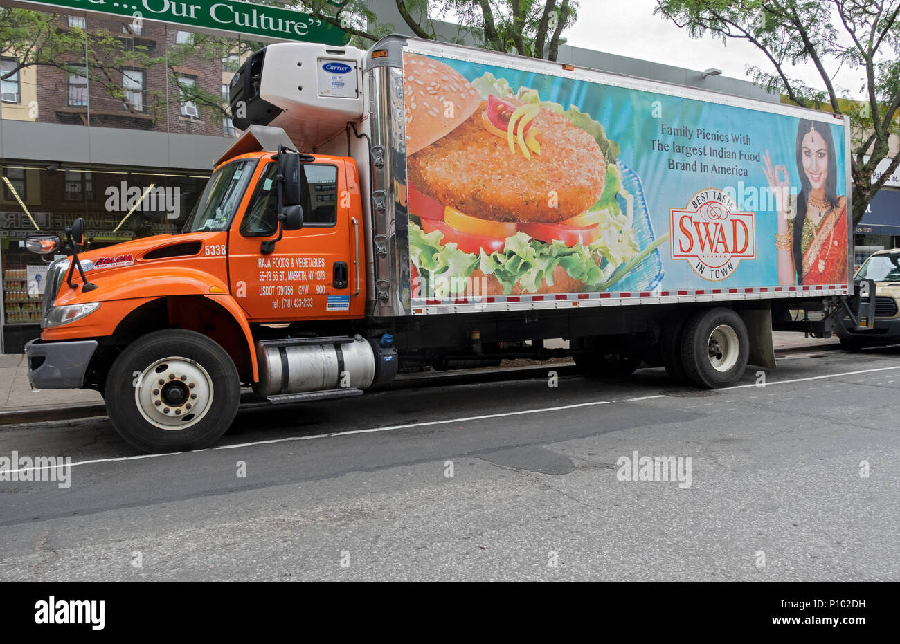 A large SWAD delivery truck bringing Indian food to Patel Brothers market on 74th Street in Jackson Heights, Queens, New York City Stock Photo