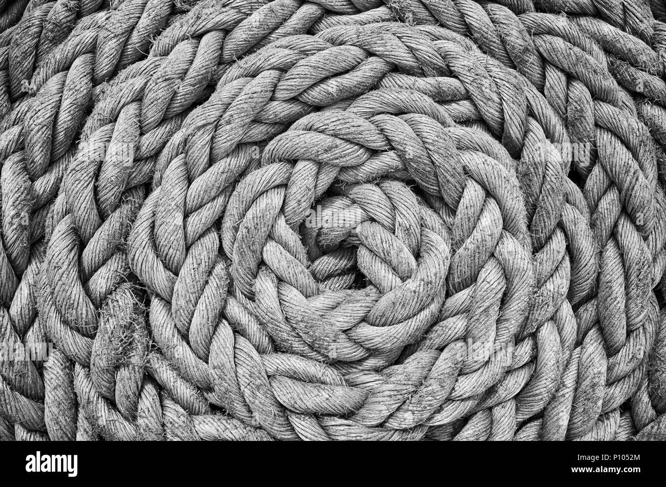 Black and white close up picture of an old sailing ship rope. Stock Photo