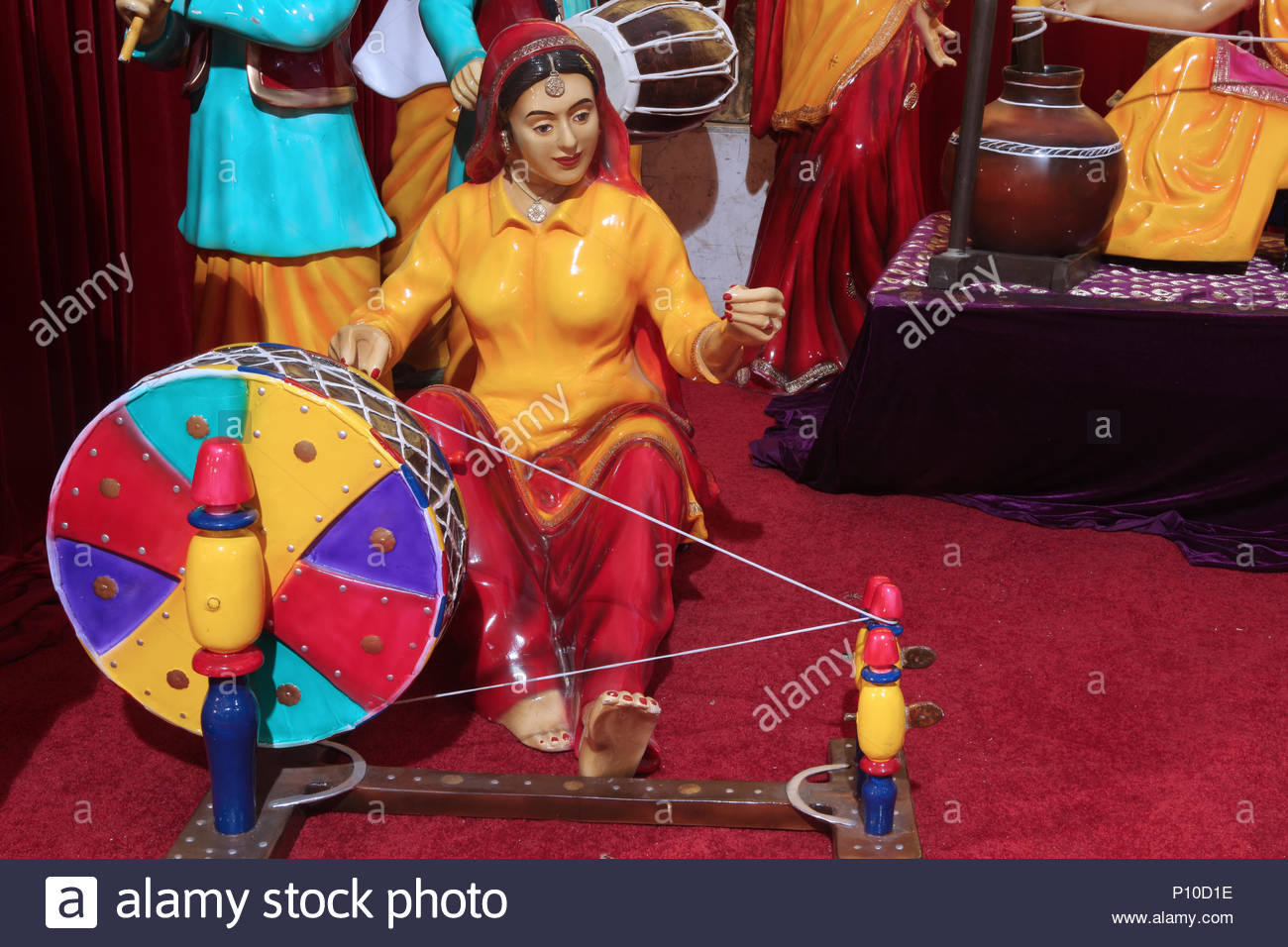 Women Using Spinning Wheel High Resolution Stock Photography and Images