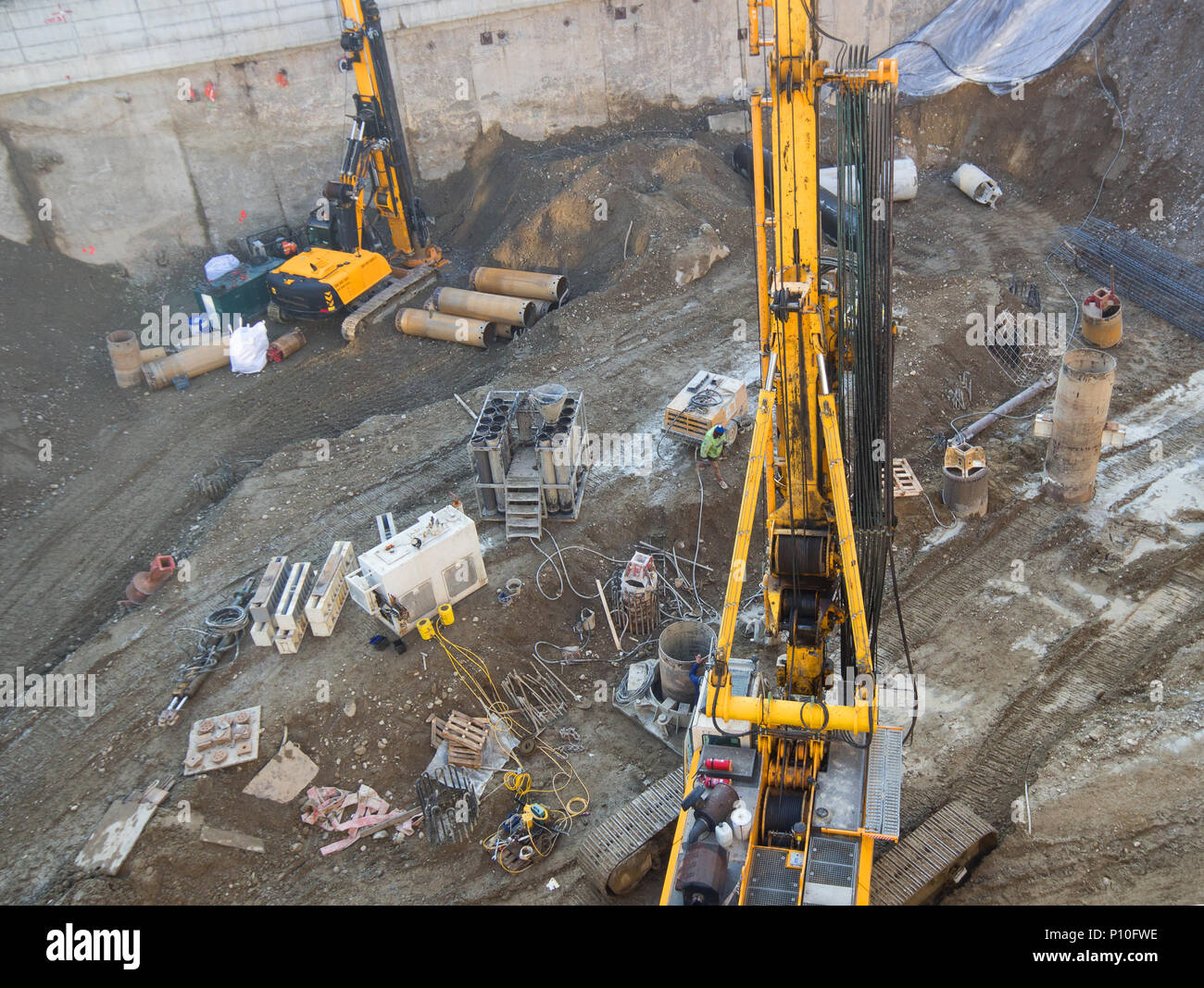 Working View Construction site workers with aerial view and machinery, people are ...