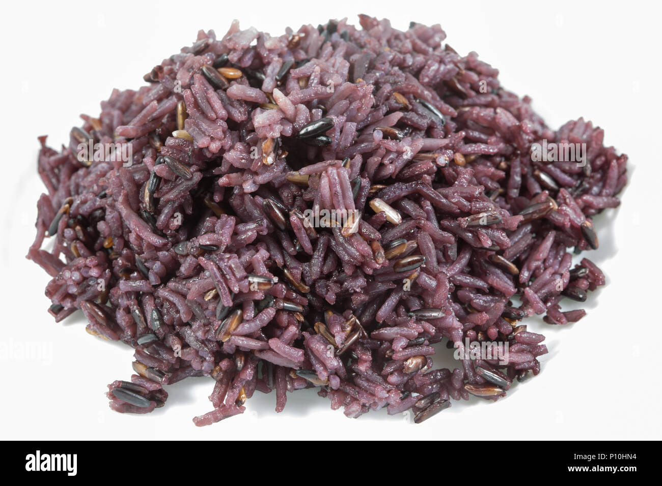 Organic cooked rice black rice, berry rice or black jasmine rice on white background, in hearty concept. Stock Photo
