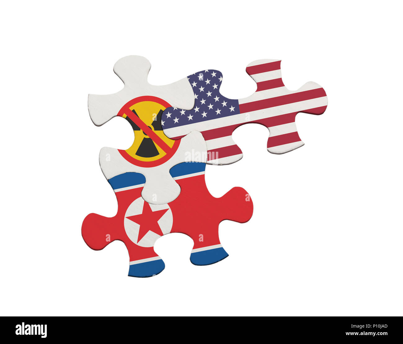 Jigsaw pieces depicting the denuclearisation issue between USA and North Korea isolated on white background Stock Photo