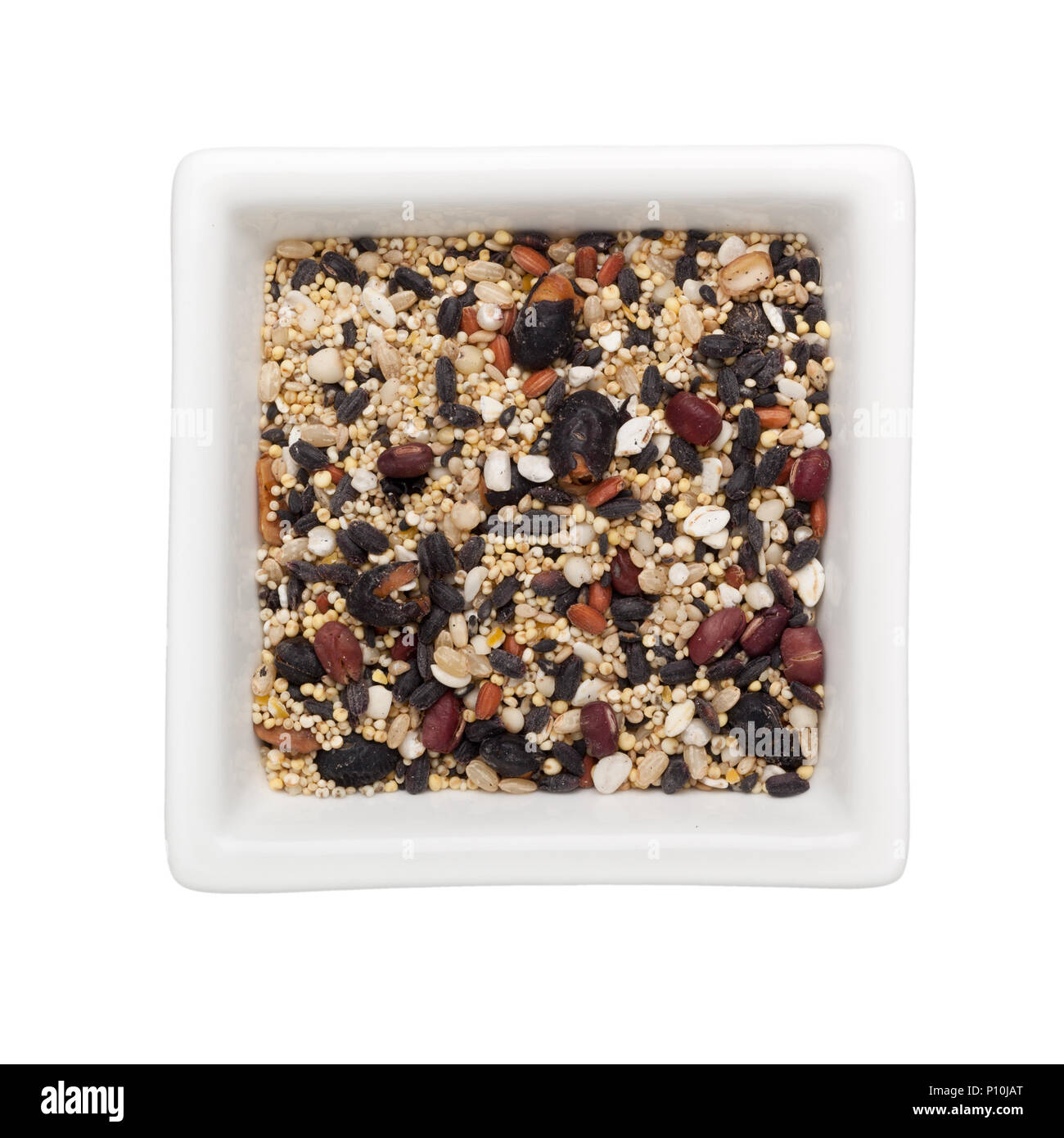 Mixed grains in a square bowl isolated on white background Stock Photo
