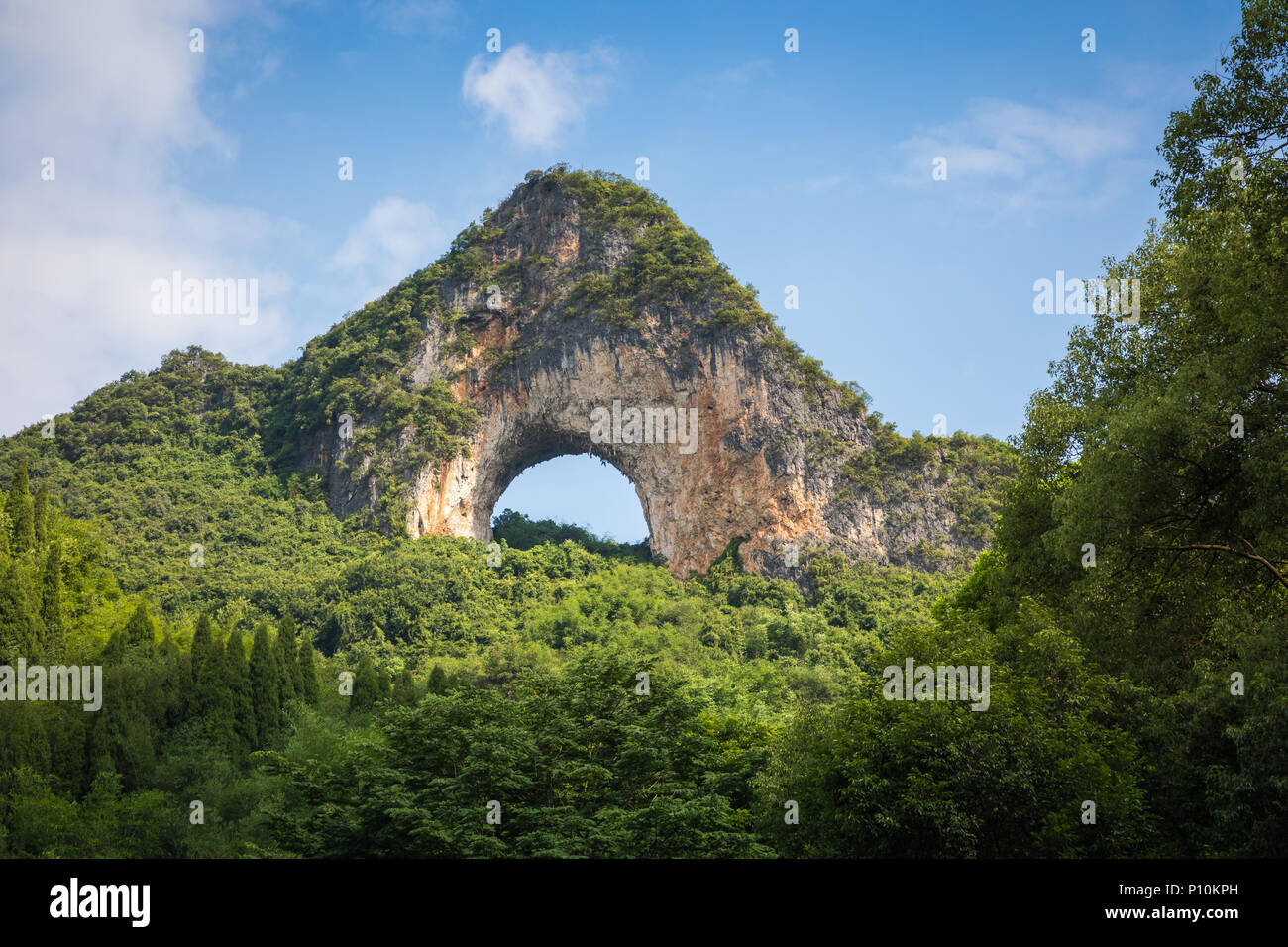 Scenic summer sunny landscape at Moon Hill, Yangshuo County of Guilin, China. Stock Photo