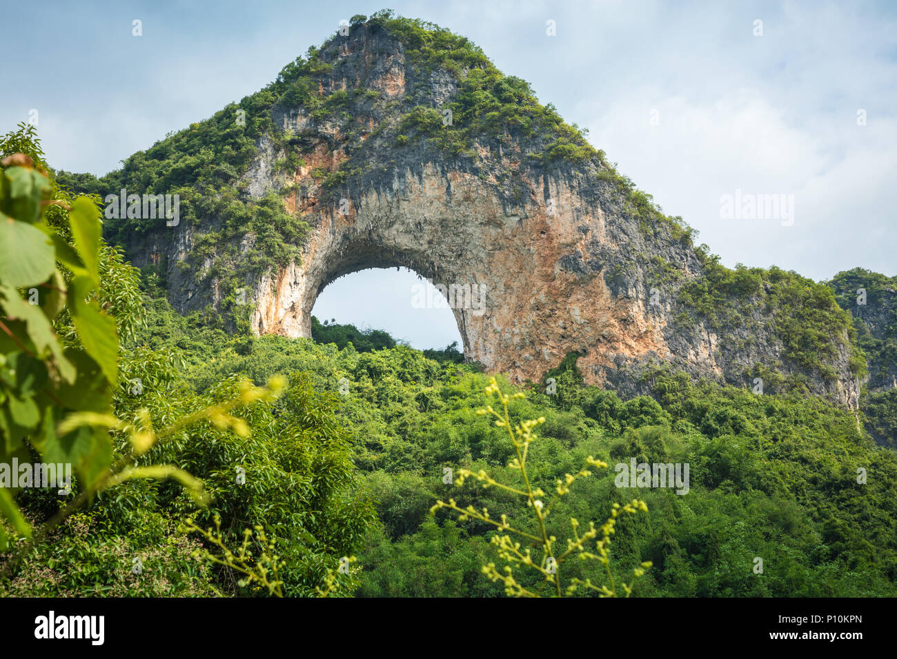 Scenic summer sunny landscape at Moon Hill, Yangshuo County of Guilin, China. Stock Photo
