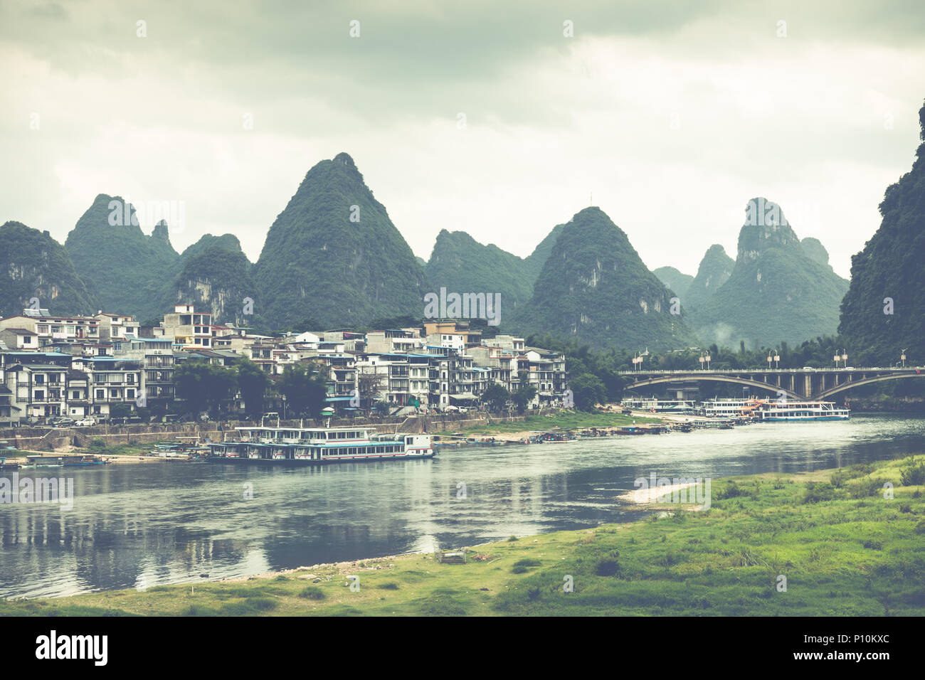 Scenic summer sunny landscape at Yangshuo County of Guilin, China. View of beautiful karst mountains and the Li River (Lijiang River) with azure water Stock Photo