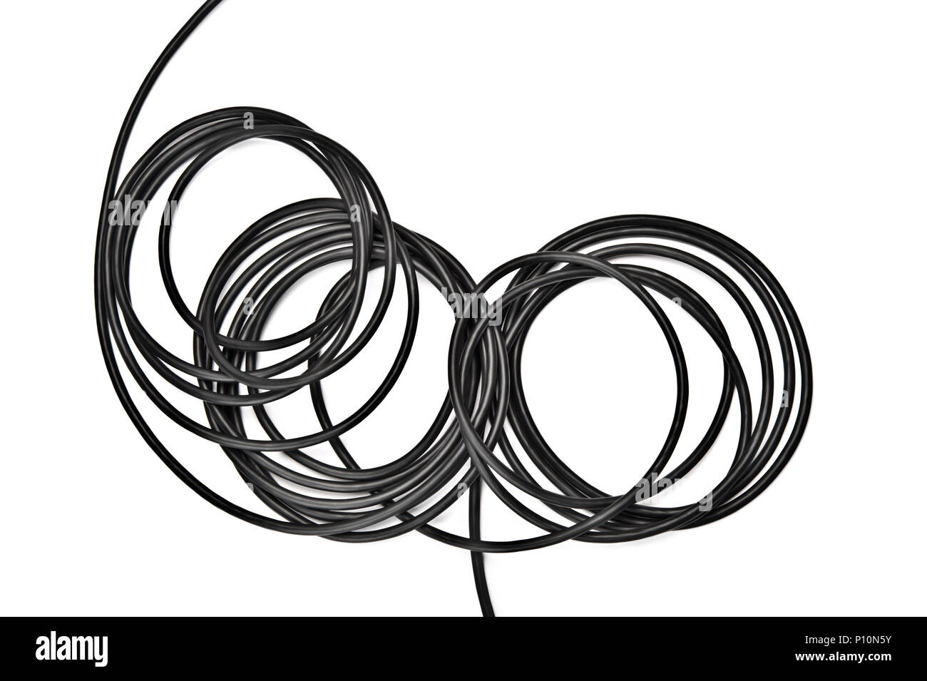 Black electric cable on white background. Stock Photo