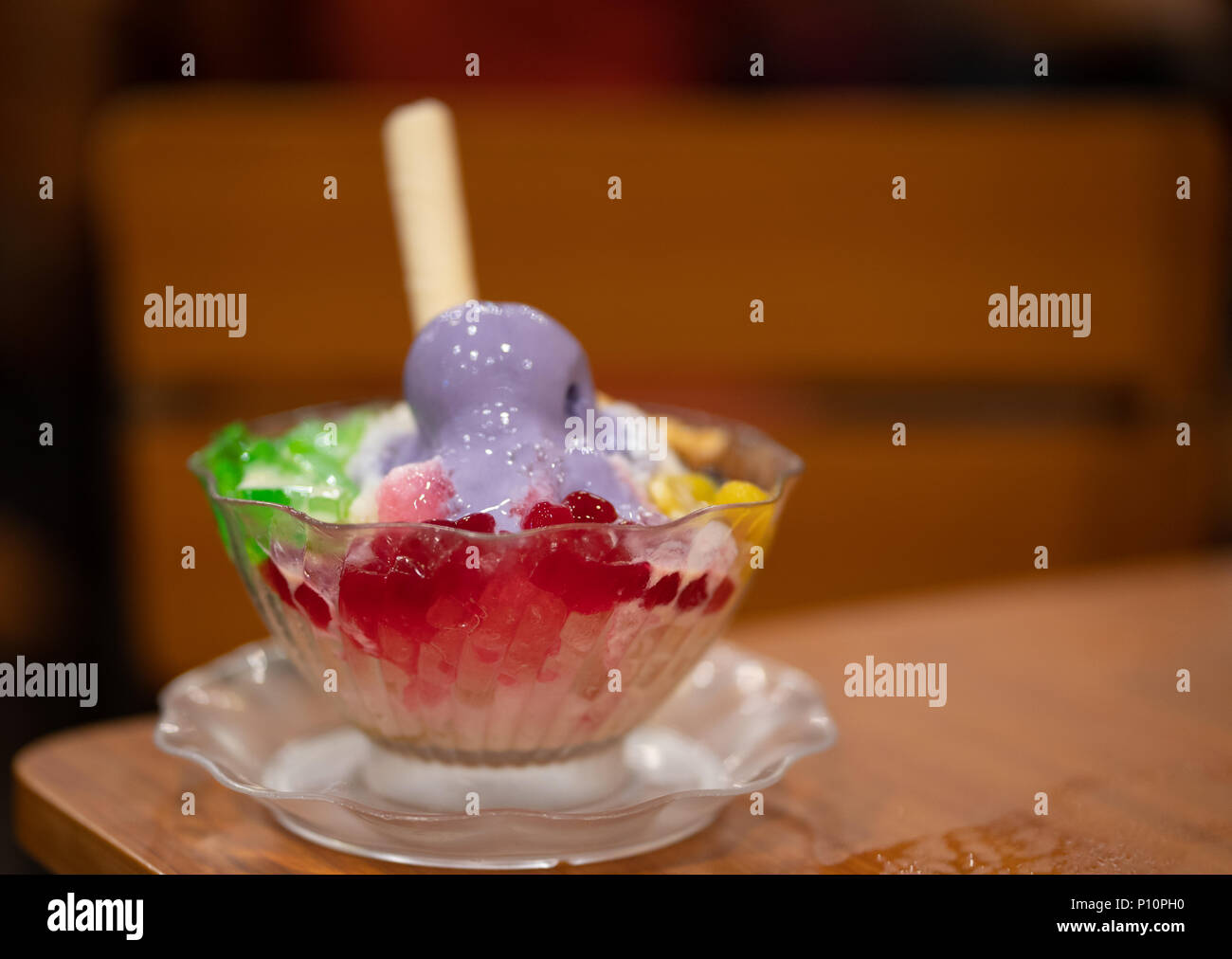 Halo Halo is a favourite Filipino dessert.A Concoction of ice shavings, evaporated milk, boiled sweetened kidney beans, sugar palm fruit, macapuno, la Stock Photo