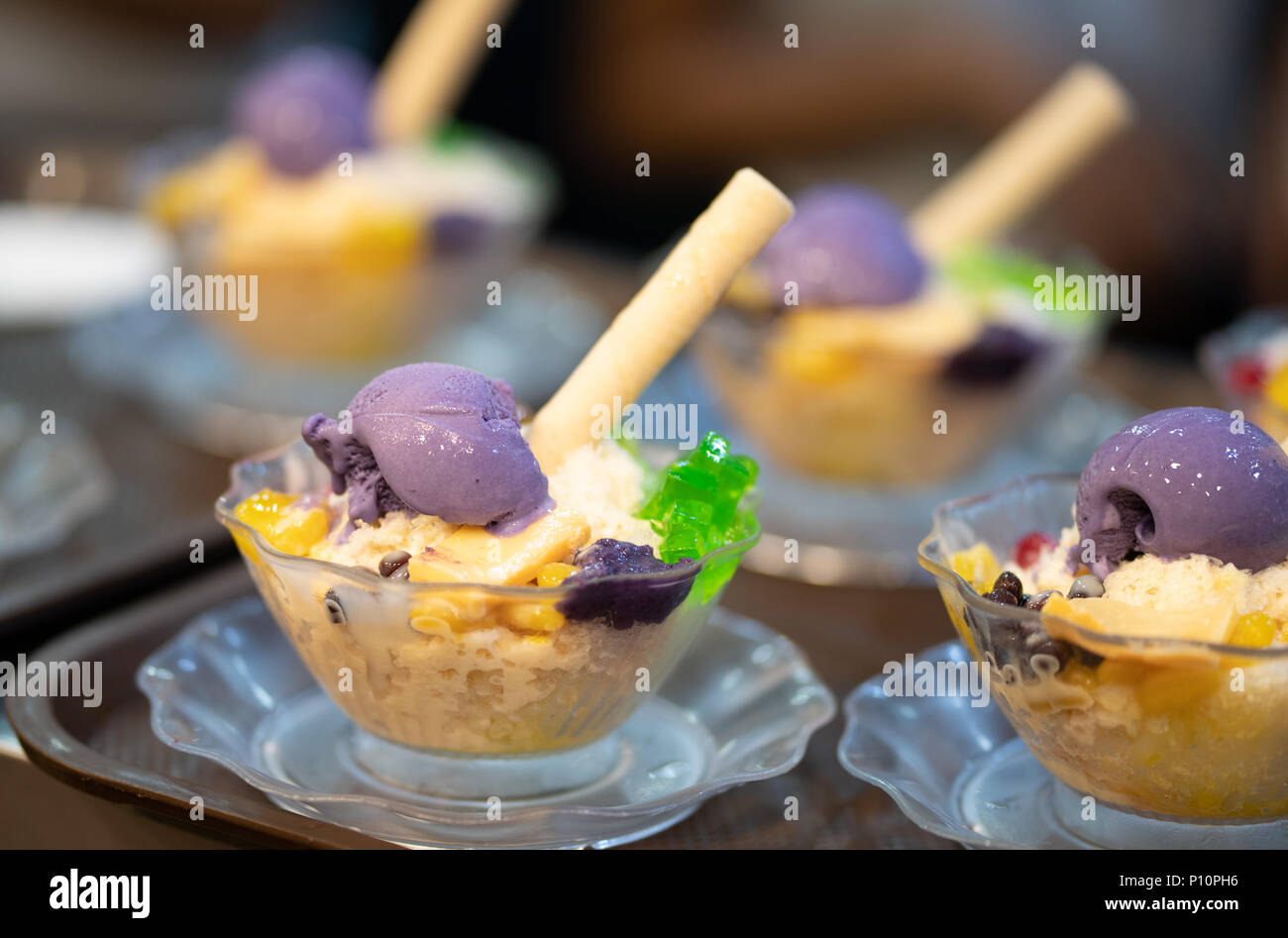 Halo Halo is a favourite Filipino dessert.A Concoction of ice shavings, evaporated milk, boiled sweetened kidney beans, sugar palm fruit, macapuno, la Stock Photo