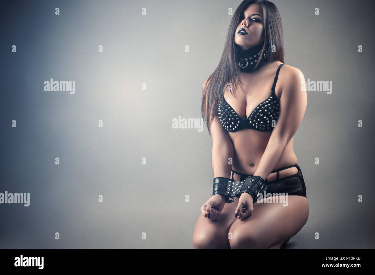 beautiful sexy submissive slave woman kneeling Stock Photo - Alamy