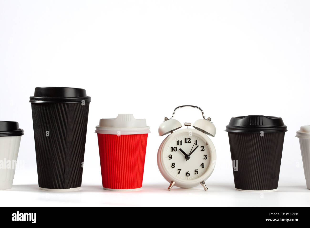 Time for coffee concept with retro alarm clock and coffee cups on white background with copy space Stock Photo