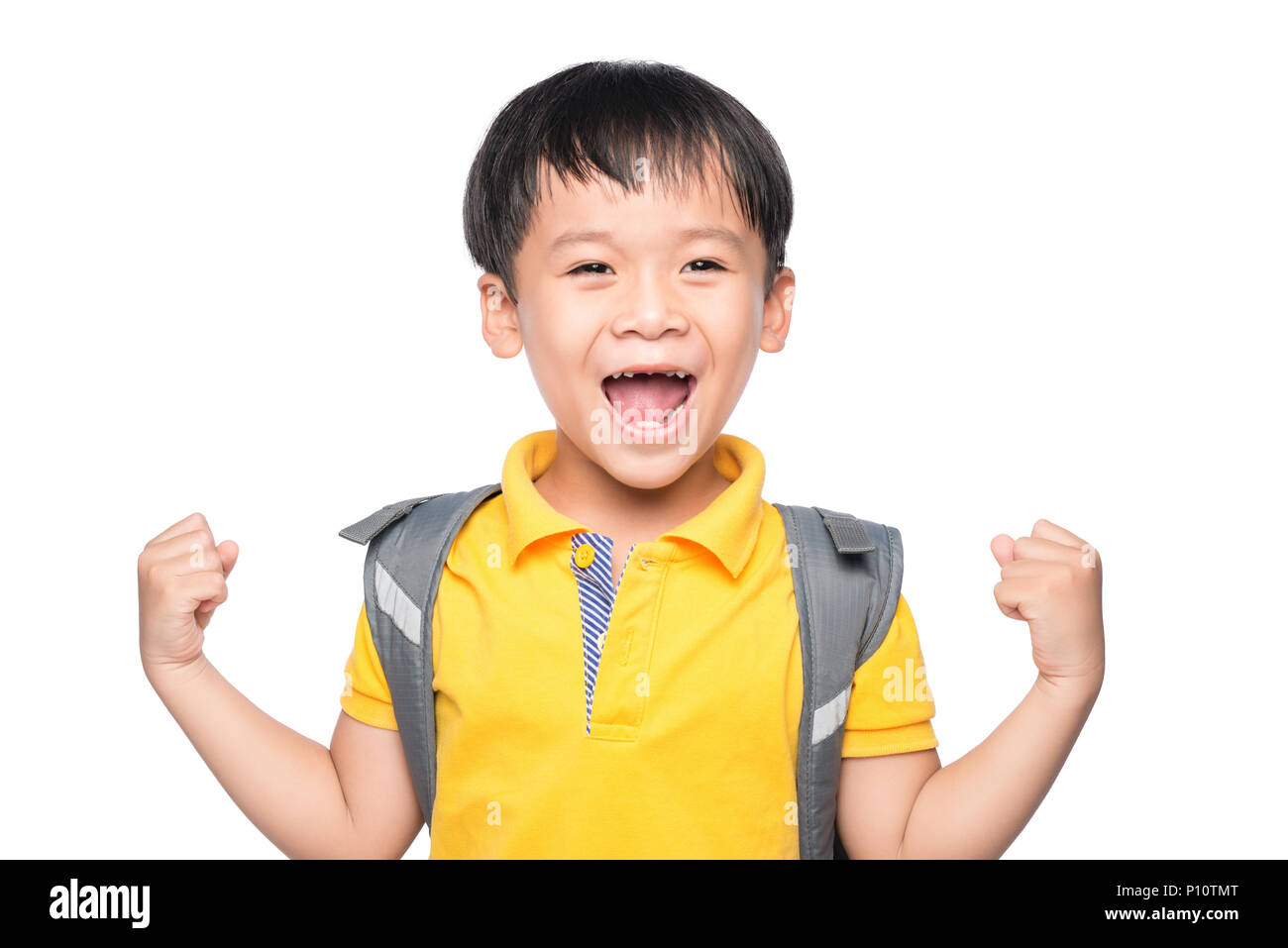 Very happy young boy with hands raised in the air Stock Photo - Alamy