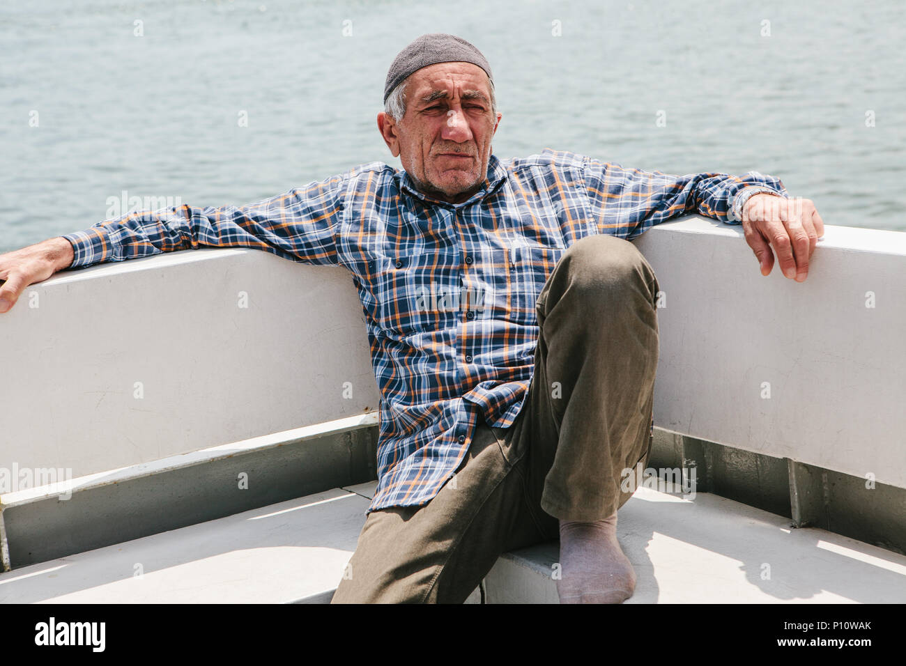 Istanbul, June 17, 2017: An elderly local man swims by ferry across the Bosphorus. Ordinary life in Turkey Stock Photo