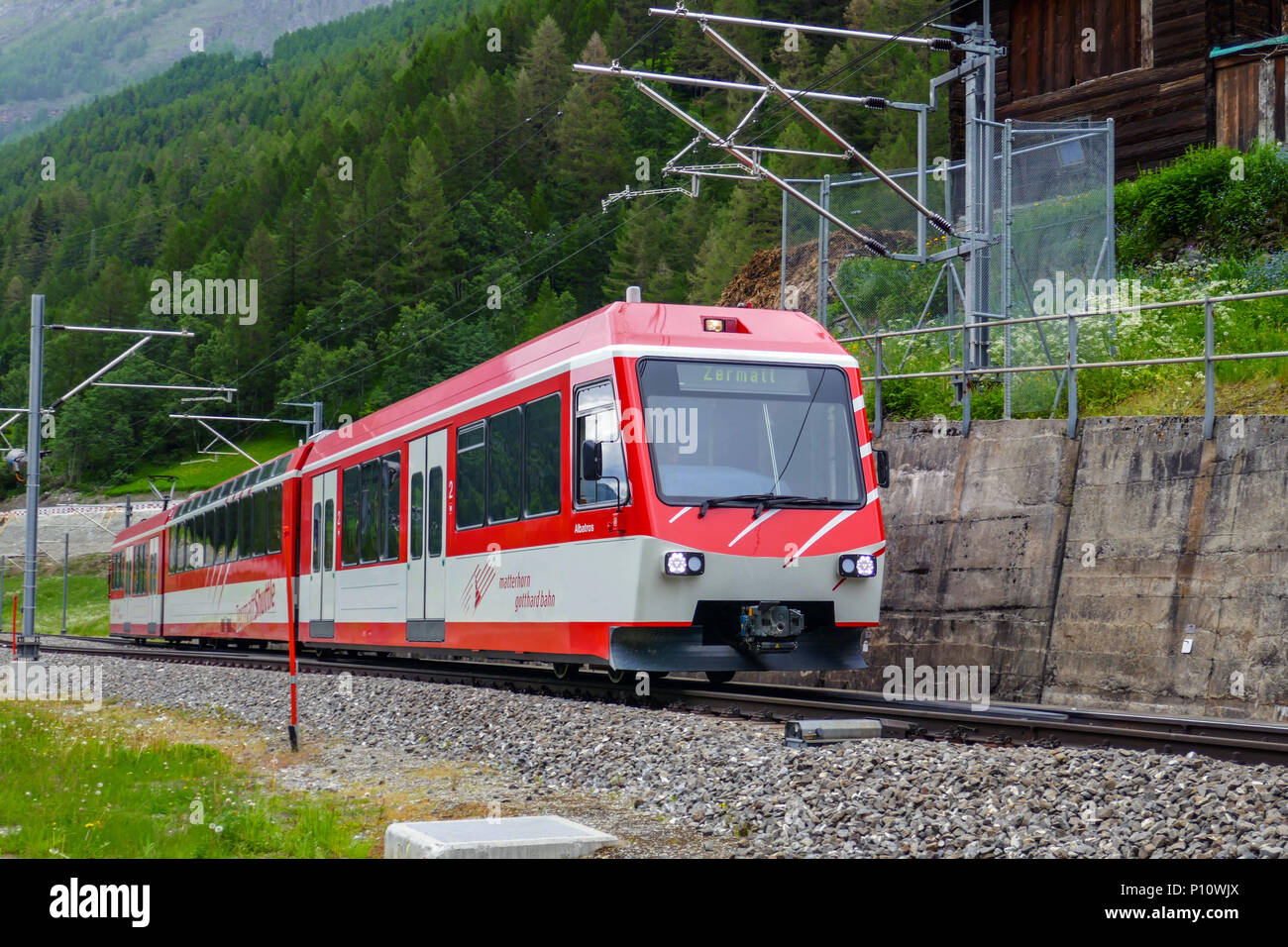 Red electric train running between Tasch and Zermatt, Mattertal, Zermatt,  Switzerland, Alps, Alpine Stock Photo - Alamy