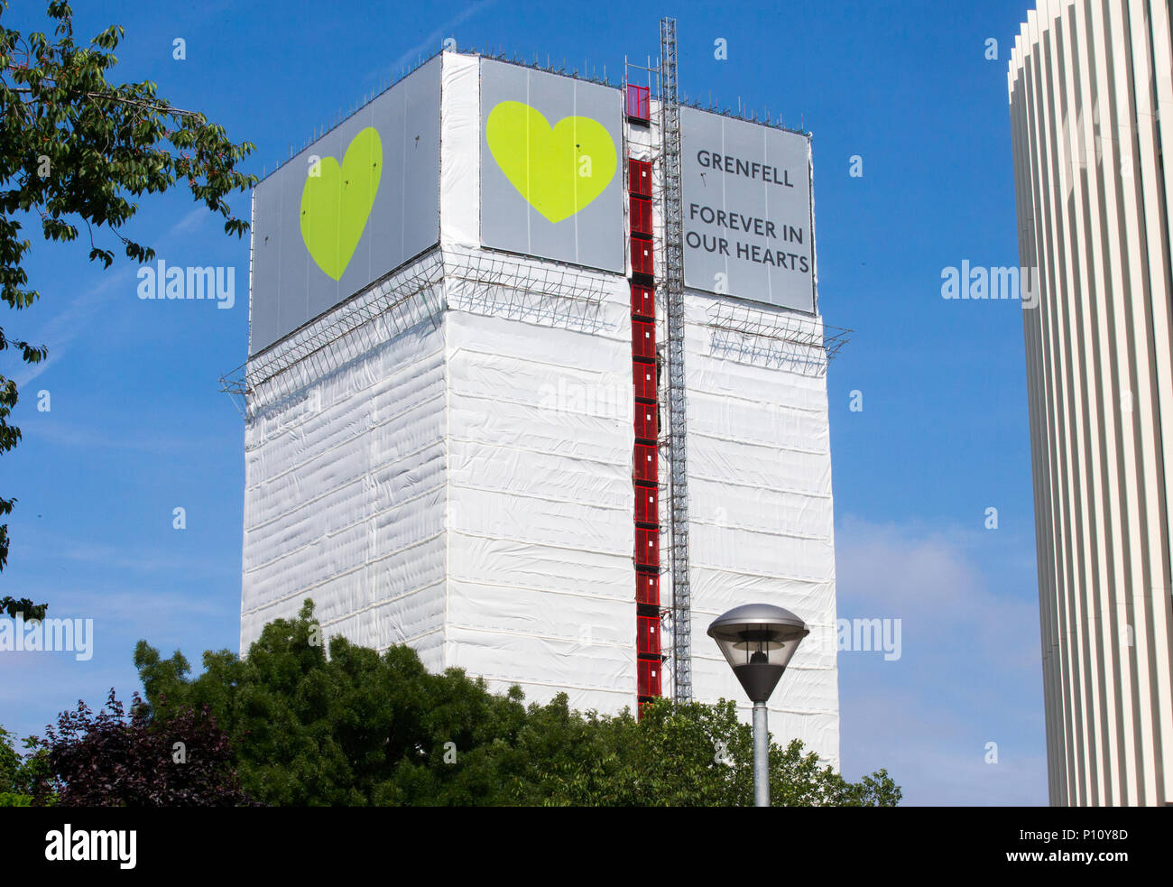 Grenfell Tower where at least 72 people died after a fire broke out on June 14th 2017 in North Kensington with the slogan 'Forever in our Hearts'. Stock Photo