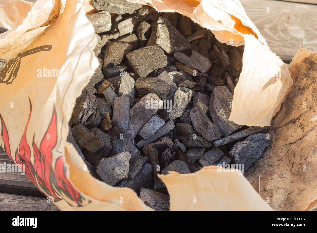 Black glossy coal for bonfire and bbq from supermarket inside a craft