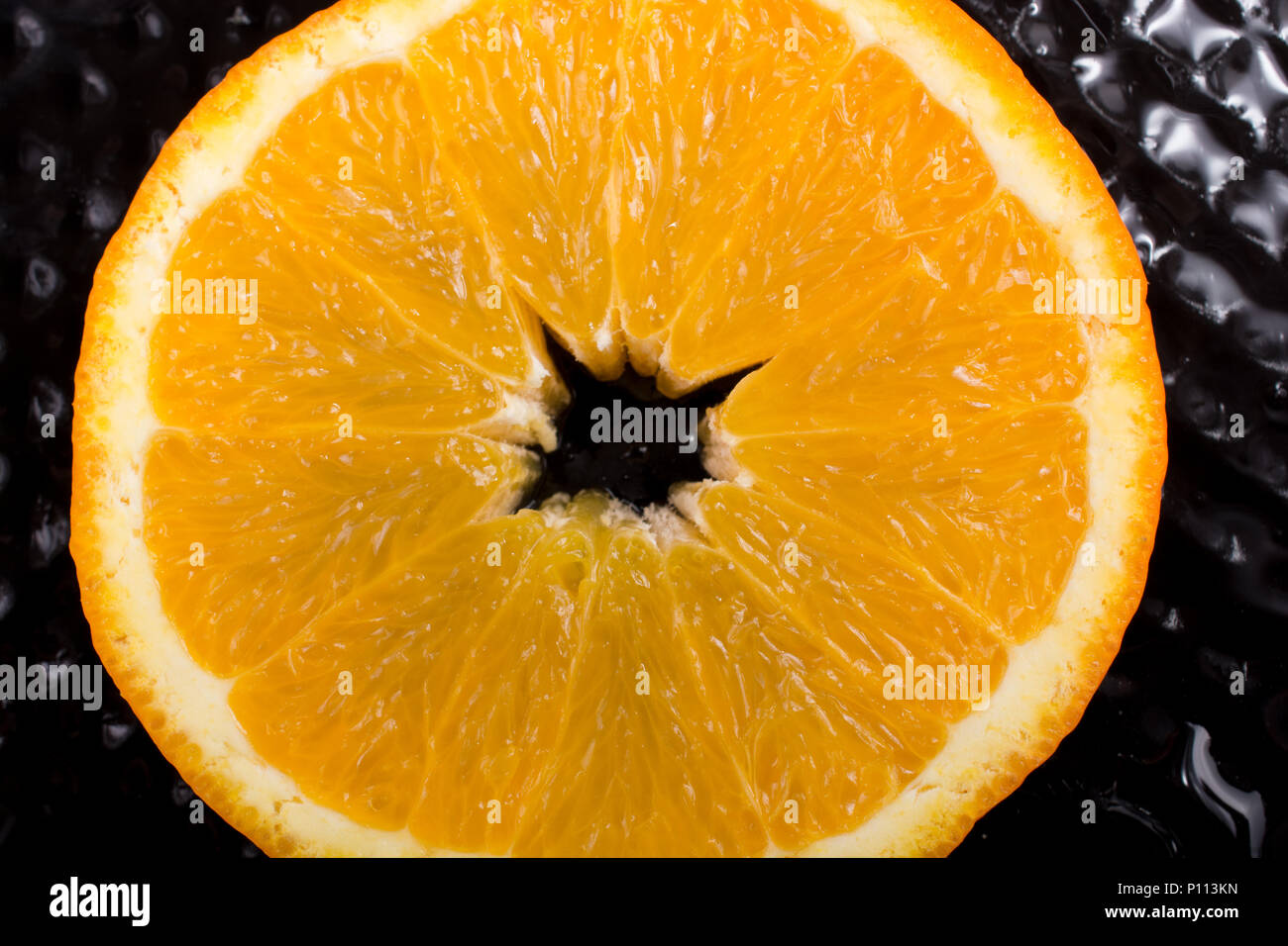 A view of a juicy, sweet and ripe cut orange fruit Stock Photo - Alamy