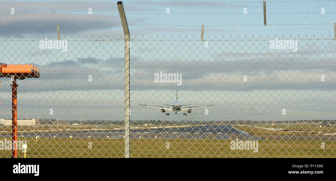 passenger aircraft landing at airport Stock Photo