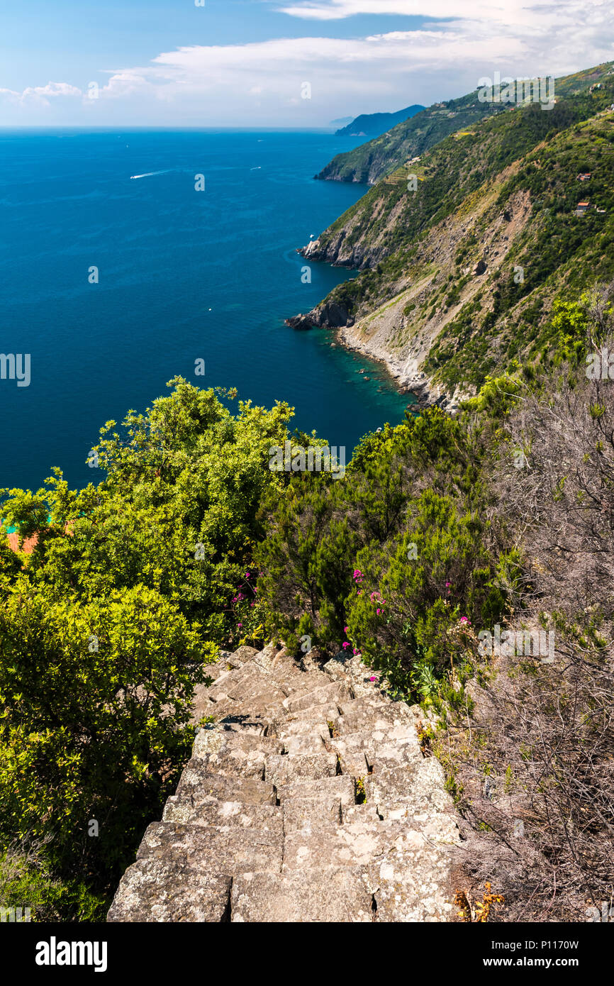 The coastline of Liguria, in the Cinque Terre area; in the foreground the staircase leading to the isolated village of Monesteroli Stock Photo