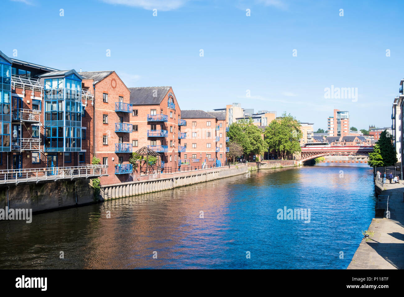 Buildings along the River Aire with Crown Point Bridge in the distance, Leeds, West Yorkshire, England, UK Stock Photo