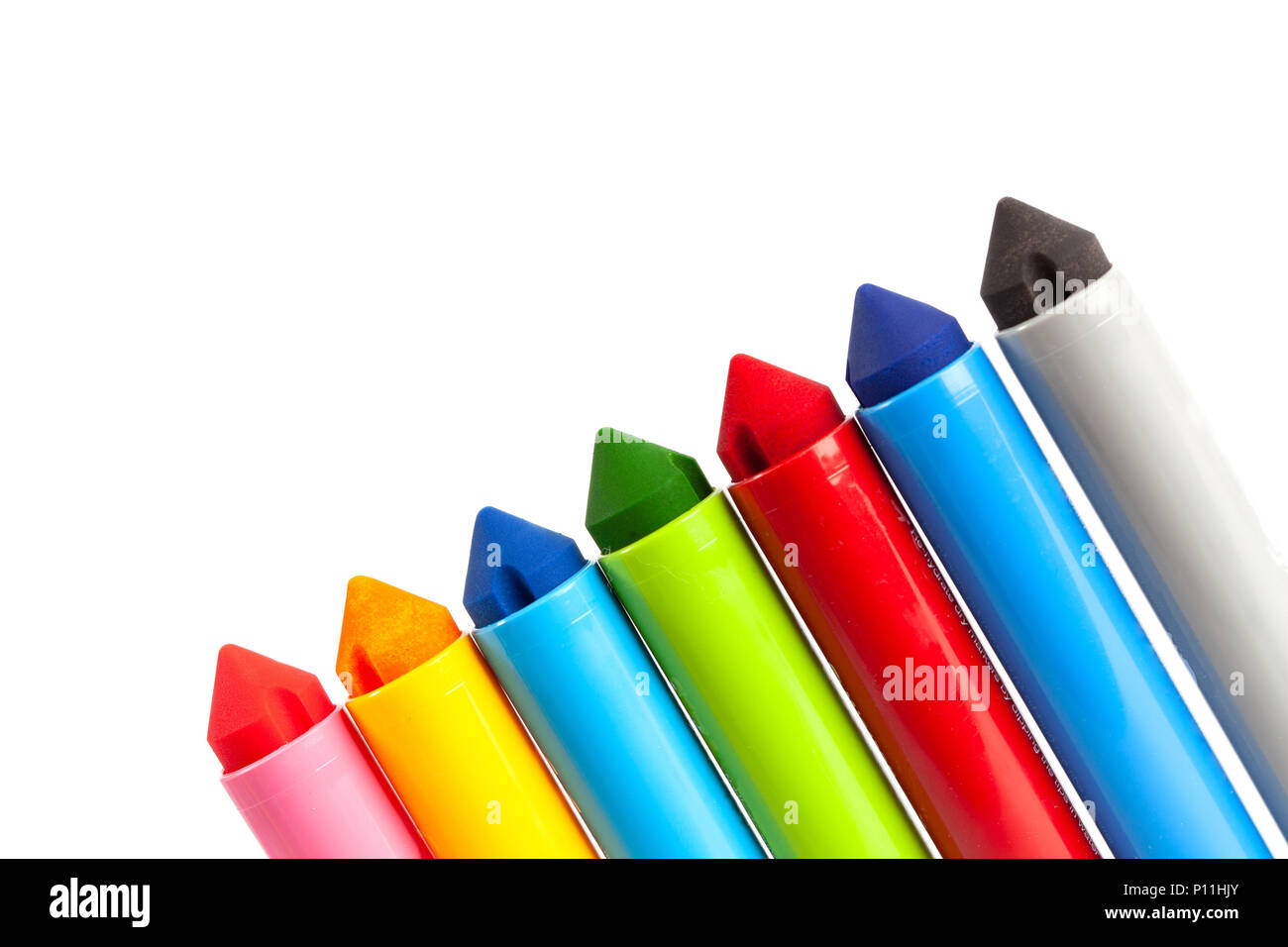 Diagonal row of chunky large kids markers on white background with copy space Stock Photo