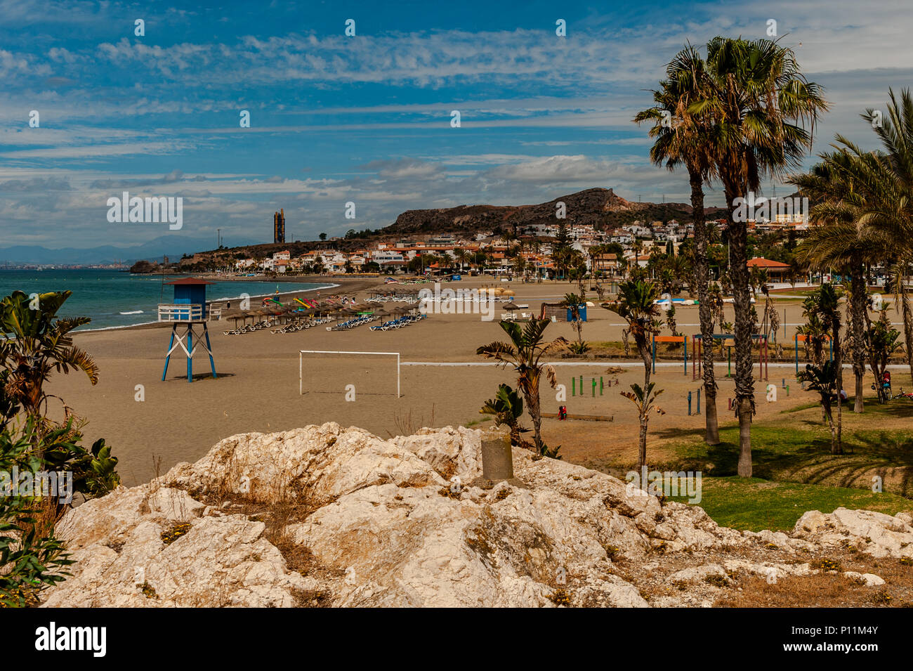 Spanish beach in Axarquía, la Cala del Moral municipality of Rincón de la Victoria, Malaga, Spain on a sunny day with copy space. Stock Photo