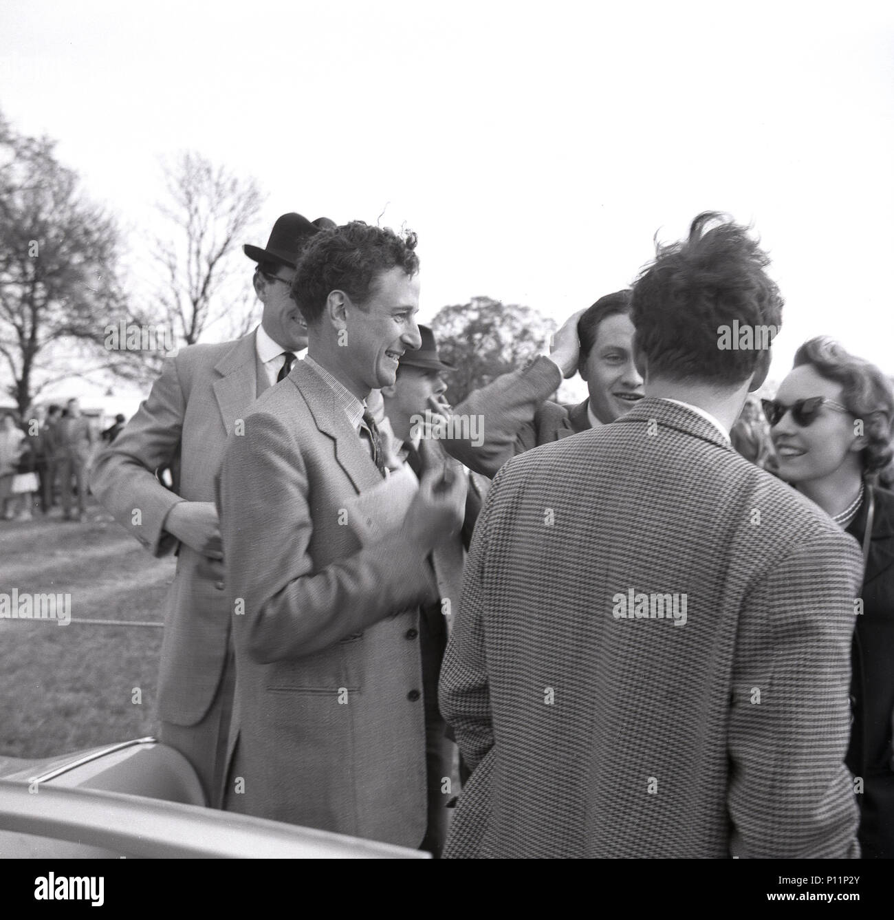 1958, May, well-dressed race goers talk together at a point-to-point amateur horse race meeting at Penshurst, Edenbridge, England, UK. Stock Photo