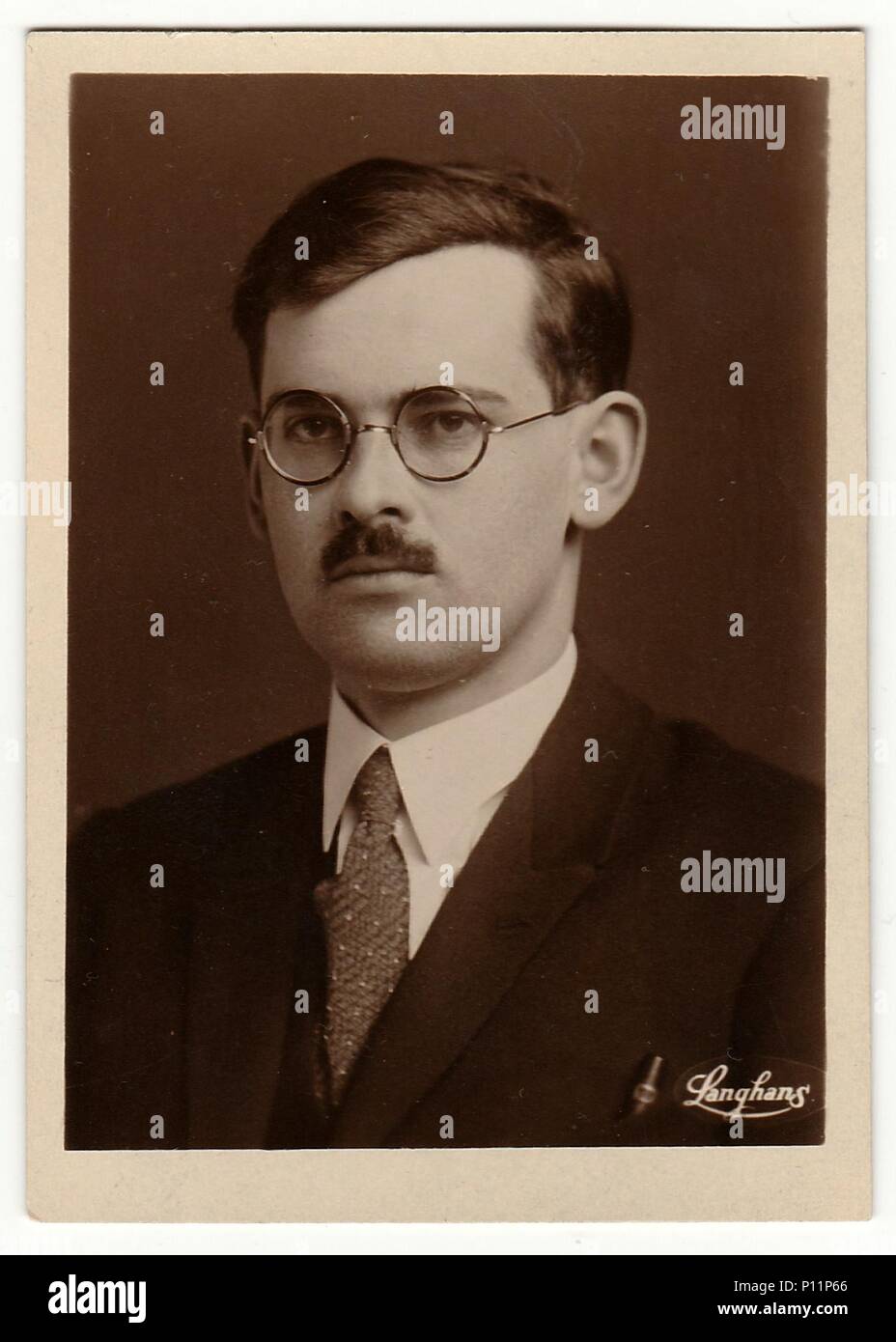THE CZECHOSLOVAK REPUBLIC - CIRCA 1920s: Vintage photo shows young man with  glasses and moustache. Antique black white photo with sepia tint Stock  Photo - Alamy