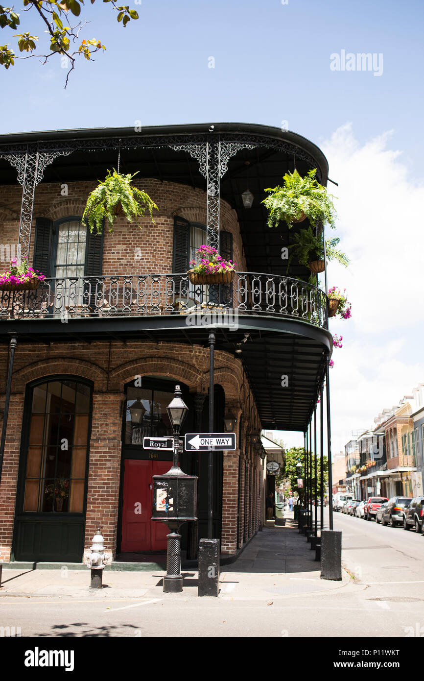 A traditional style building with wrought iron balcony in the French