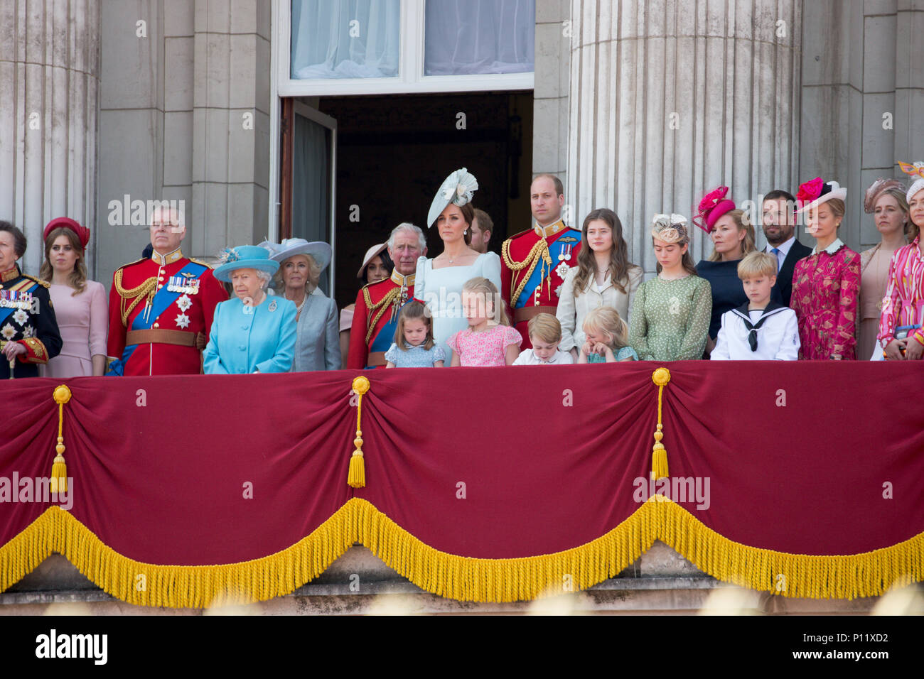 The Royal Family on the balcony of Buckingham Palace watching the flypast at the Trooping the Colour in London today.  The Duke and Duchess of Sussex have joined the Queen for the Trooping the Colour parade to mark her 92nd birthday.  Print Harry and Meghan Markle, who married last month, arrived as part of the carriage procession.  Large crowds of spectators gathered to watch Saturday's ceremony, which saw around 1,000 soldiers march to Horse Guards Parade in Whitehall. Stock Photo