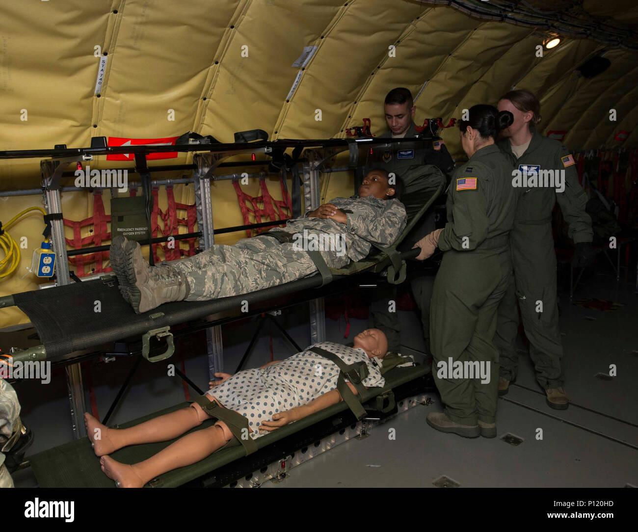 Members of the 86th Aeromedical Evacuation Squadron lift a simulated