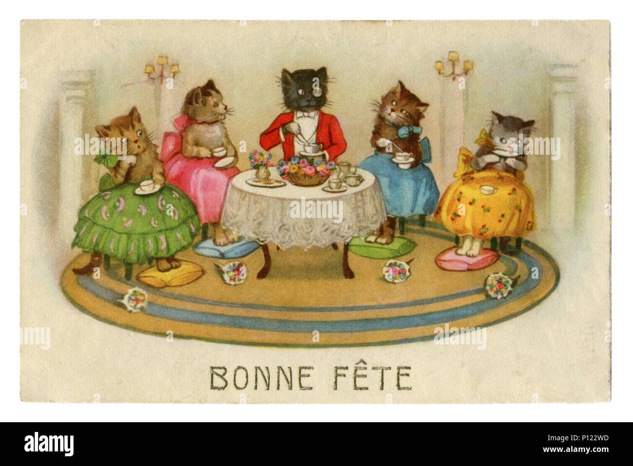 French historical postcard: Cats as people. Happy birthday! Tea party. Cat in a suit with a pince-nez and a girl kittens in colored skirts, France Stock Photo