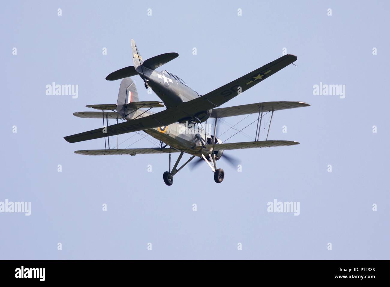 The oldest surviving Fairey Swordfish in the world operated by the Royal Navy Historic Flight flying with a North American T-6 Harvard at Shuttleworth Stock Photo